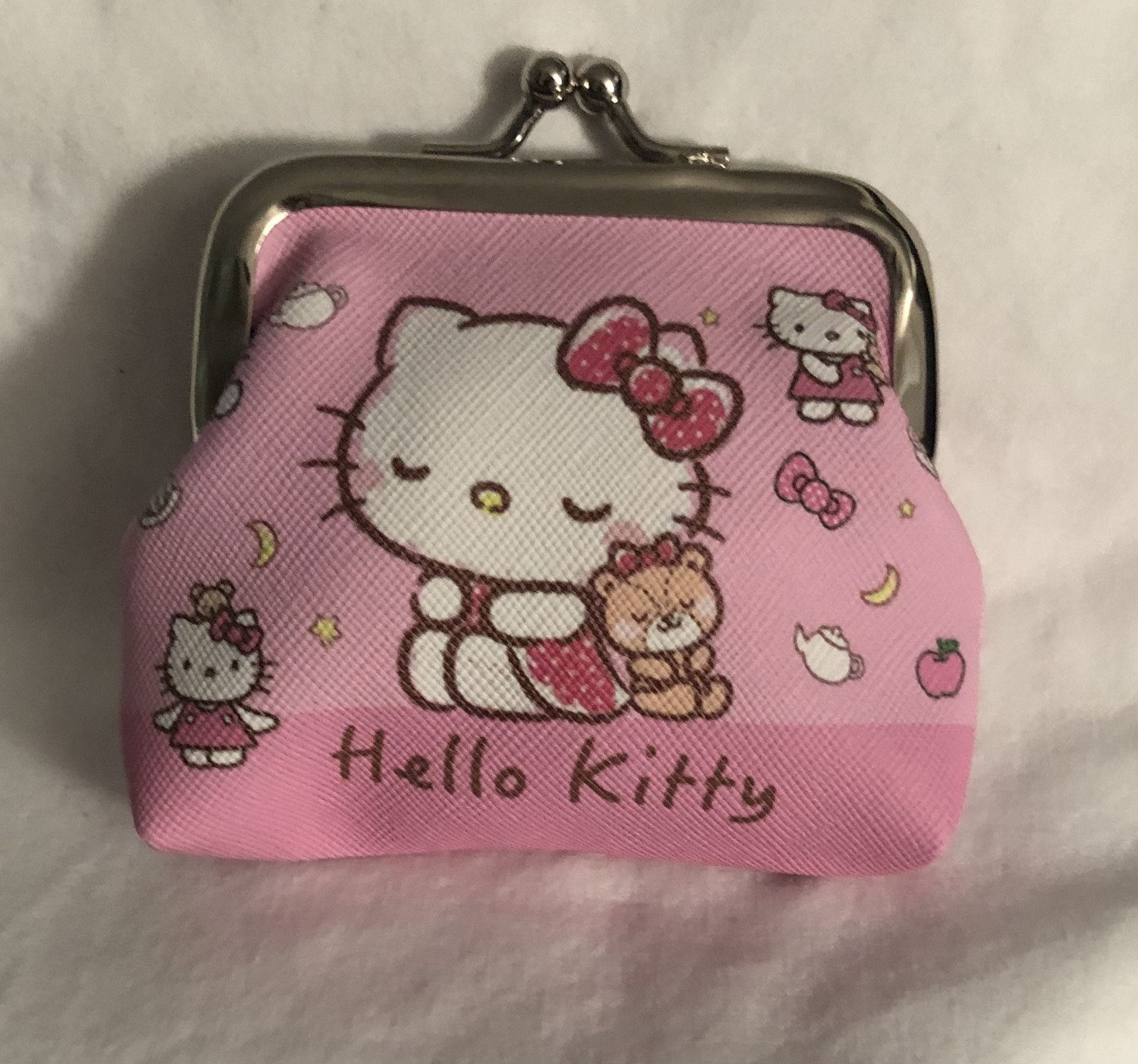 Hello Kitty coin purse Hello Kitty graphics with kiss lock closures pink.