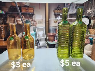 Yellow and green bottles
$3 for the short yellow ones
$5 for the tall green ones
Use as a vase