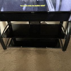 44” TV Stand All Black W / black glass 20$