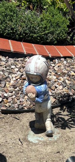 Boy football player statue