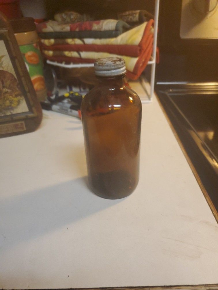 Vintage Mid 20th Century Brown Glass Bottle With A Screw Cap