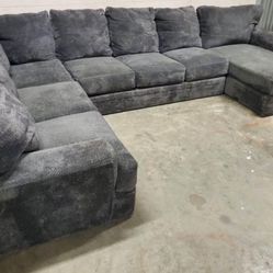 Grey sectional / couch - will deliver 