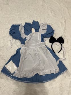 New blue Alice-style costume with a white apron. blue dress fabric with puff sleeves creates a timeless look. Includes removable white apron and coord