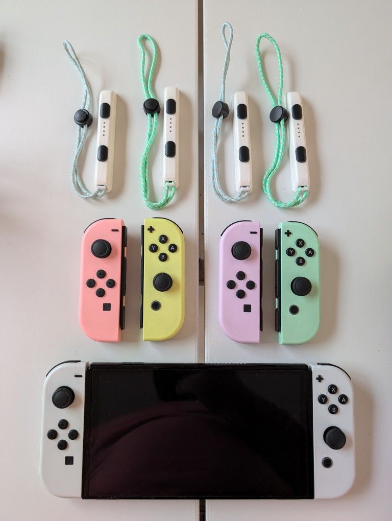 Lots Of Nintendo Switch Stuff - Standard and OLED Systems, Extra JoyCons, Docks, Cases, Stands, Game Organizer, Joycon Charger Dock Attachment