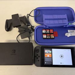 Nintendo Switch with charger and six games