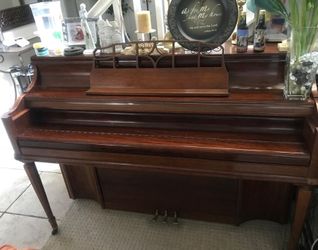 Brown wooden frame upright Kimbal piano