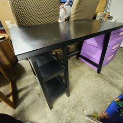 Simple black desk with two shelves.
42"w x 24"d x 30"h 