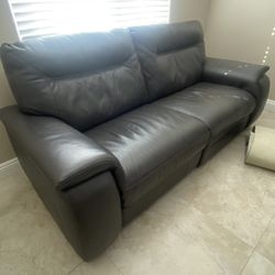 Grey leather reclining couch