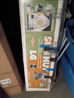 Sun Hut brand portable greenhouse, specifically the large 2' x 4' model designed to hold hydro systems.The product features 30% more reflective materi