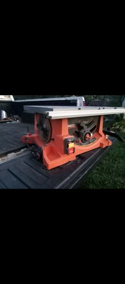 Portable rigid table saw like new used couple times with some blades and attachments