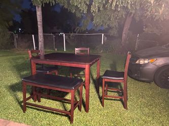 Brown dining table and chairs