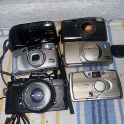 6 Perfect Condition Tested Film Cameras. One Roll Of Fuji And New Battery Included. 