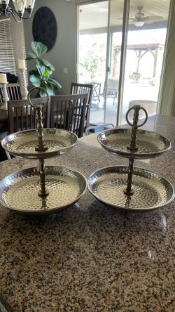 two matching 2-tier hammered-metal serving stands/trays.