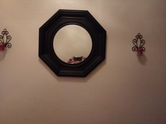 A mirror with two scones