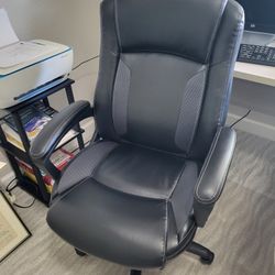 Office Chair: PLUSH BLACK LEATHER, SWIVEL, ADJUSTABLE HEIGHT, 8 MONTHS OLD, NO RIPS OR TEARS, SMOKE FREE HOME OFFICE, ON CASTERS, NO ISSUES