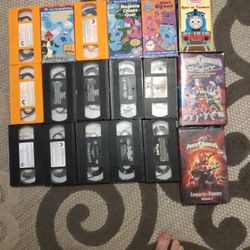 A Variety Of VHS Tapes And CDs