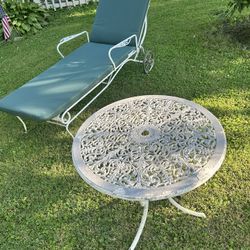 Wrought Iron Lounger With Wheels And Brand New Cushion and Wrought Iron Table $125 OBO 