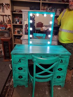 Vanity with lighted mirror and chair