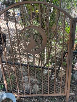 Heavy duty wrought iron gate with Southwestern design.