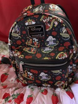 The Loungefly Disney Villains Tattoo All Over Print Mini Backpack
