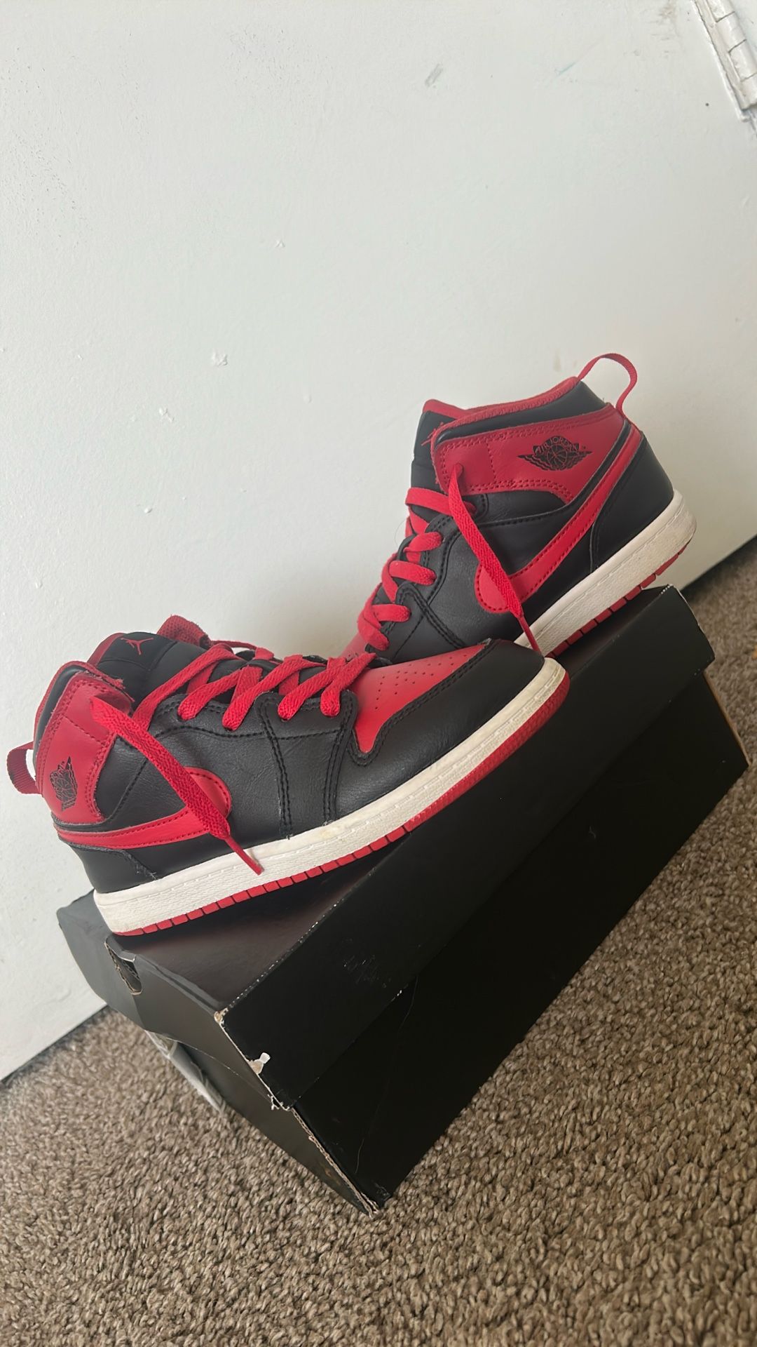 Black and Red Jordan 1 Mids