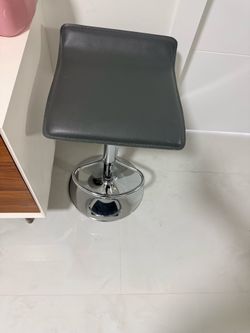 Two gray barstools