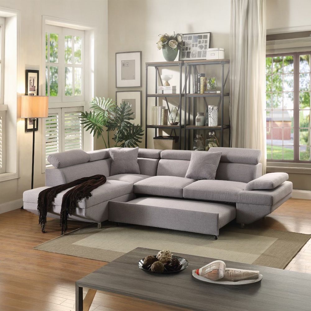New Grey Fabric Sectional/Bed Convertible. 108x75x35H; 78/91”L X 58”W. Free Delivery!
