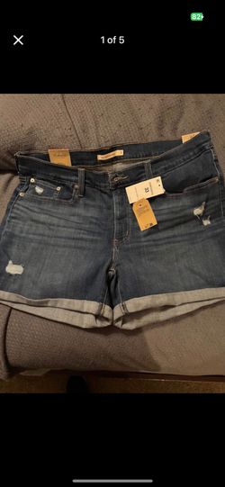 Women Levi mid-length blue jean shorts size 33. Brand new with tags