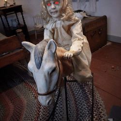 Animations Spirit Halloween Store ROCKING HORSE AND DOLL 