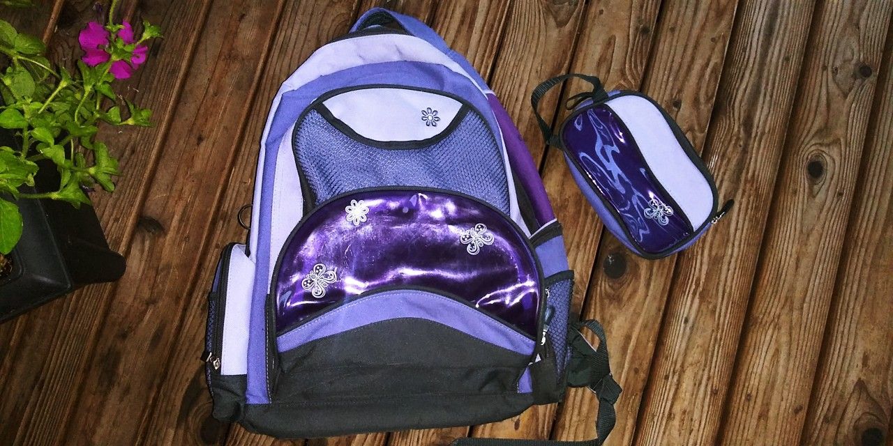 Girls purple backpack with matching pencil case... heavy duty bag... good to carry heavy books!