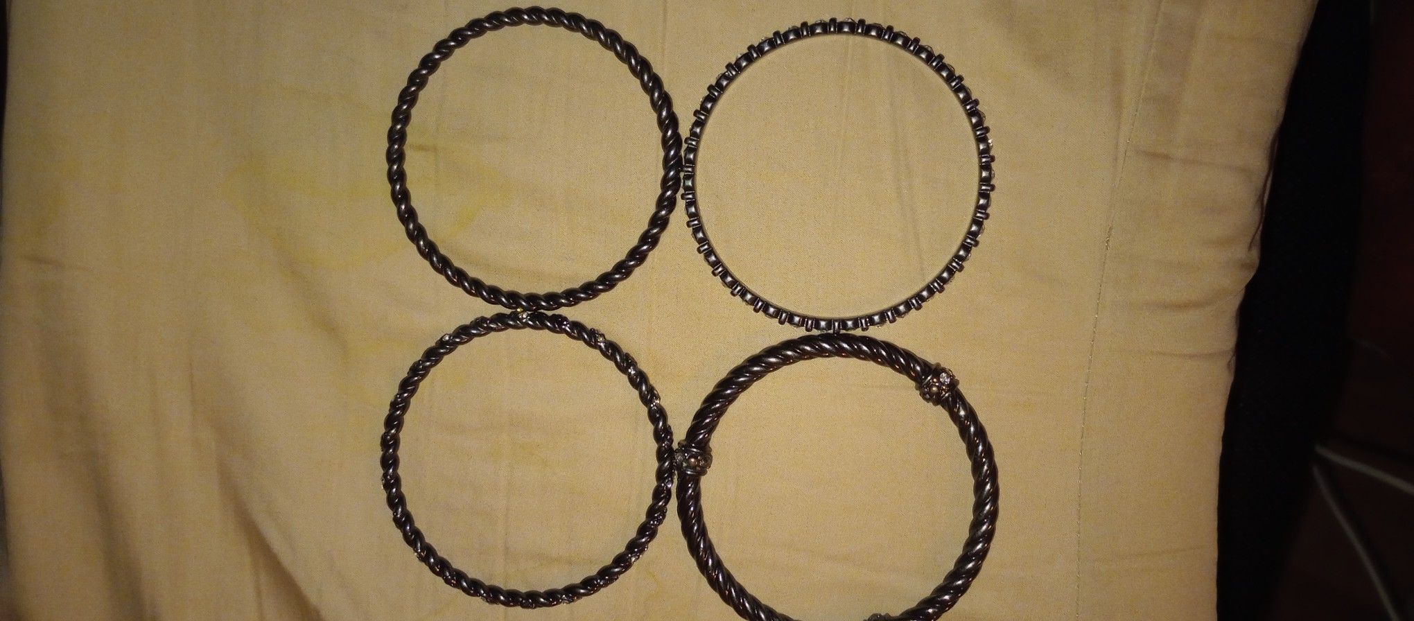 Hematite plated bangles w/sparkling cut crystal accents.
Set of 4 Bangles
Size: 8 1/4”