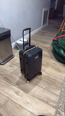 Juicy couture carry on size luggage with rollers and extension handle
