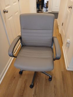 Tan comfortable  office chair used adjustable heights