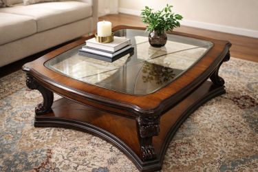 Beautiful solid wood traditional coffee table with beveled glass inset top $400