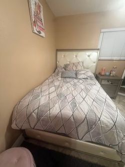 Full bedroom with one nice stand and     Dresser Mirror – the large framed mirror attached to/placed on top of the dresser.