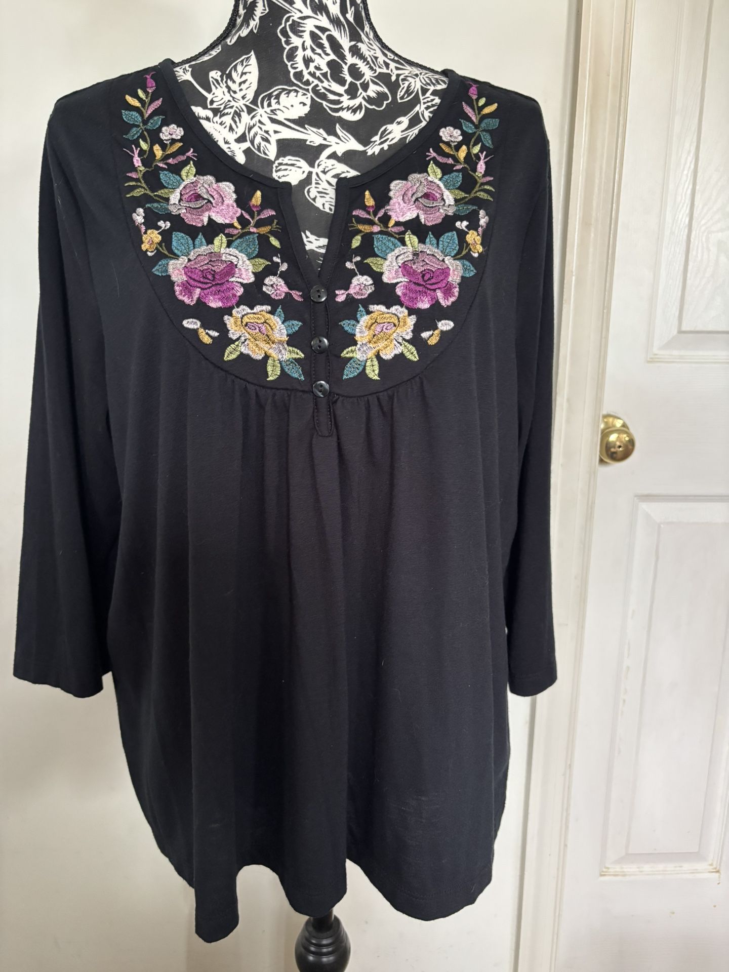 Embroidered black top for woman 2X. Preowned in excellent condition. 85% polyester, 15% rayon. Feels like cotton. Comes from a smoke free environment.