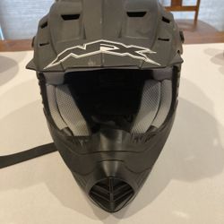 Black NFX ATV or motorcycle helmet. Purchased a year and a half ago, worn once.