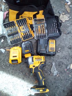 DeWalt impact drill with two batteries and drill bit sets and charger