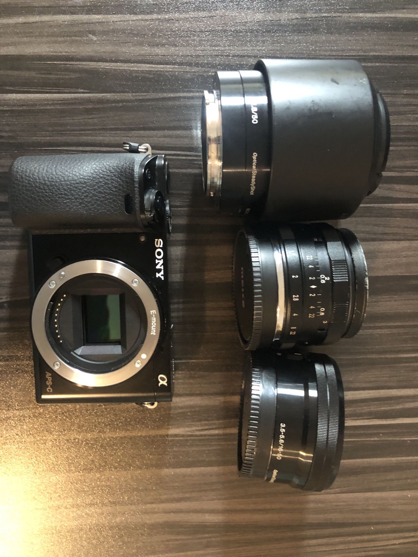 Sony a6000 camera with 3 lenses and Nikon adapter