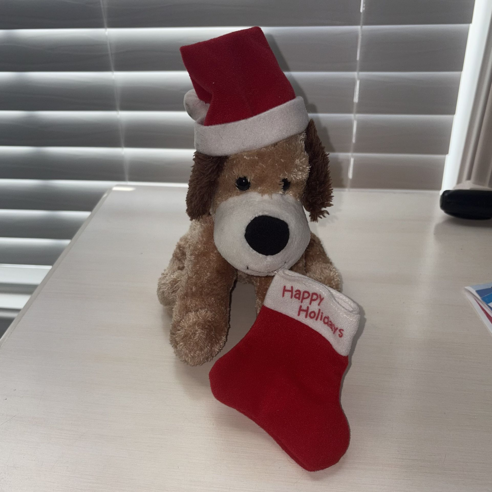 Cute Brown Christmas Puppy with Santa Hat and Happy Holidays Stocking