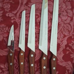 Vintage Serated 5 Pc High Carbon Steel Specialty Knife Set 
Beautifully crafted, hardwood brass riveted handles, razor sharp in excellent condition! 