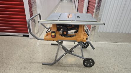 RIDGID ELECTRIC TABLE SAW WITH CART/STAND LIKE NEW $250***