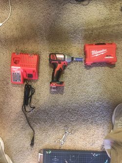 Milwaukee Impact and charger, comes with 18v battery too just not in pic! 150$