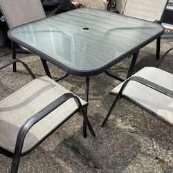 Outdoor square glass table and 4 chairs must go new set coming