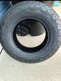 5 245/75R17 Bridgestone Dueler A/T tires. 4 have plenty of thread and 1 is 100% new.