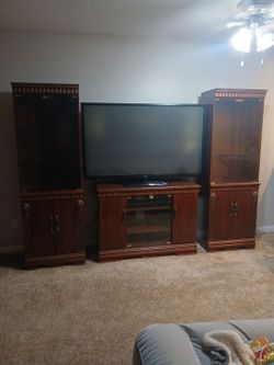 Vintage looking cherry wood entertainment  center TV included