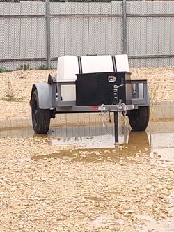 Trailer with pressure washer and title