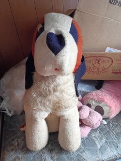 Big stuffed dog missing one eye