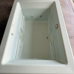 Kohler jacuzzi  with sink and toilet .