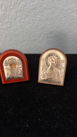 A pair of silver Greek Orthodox miniature icons